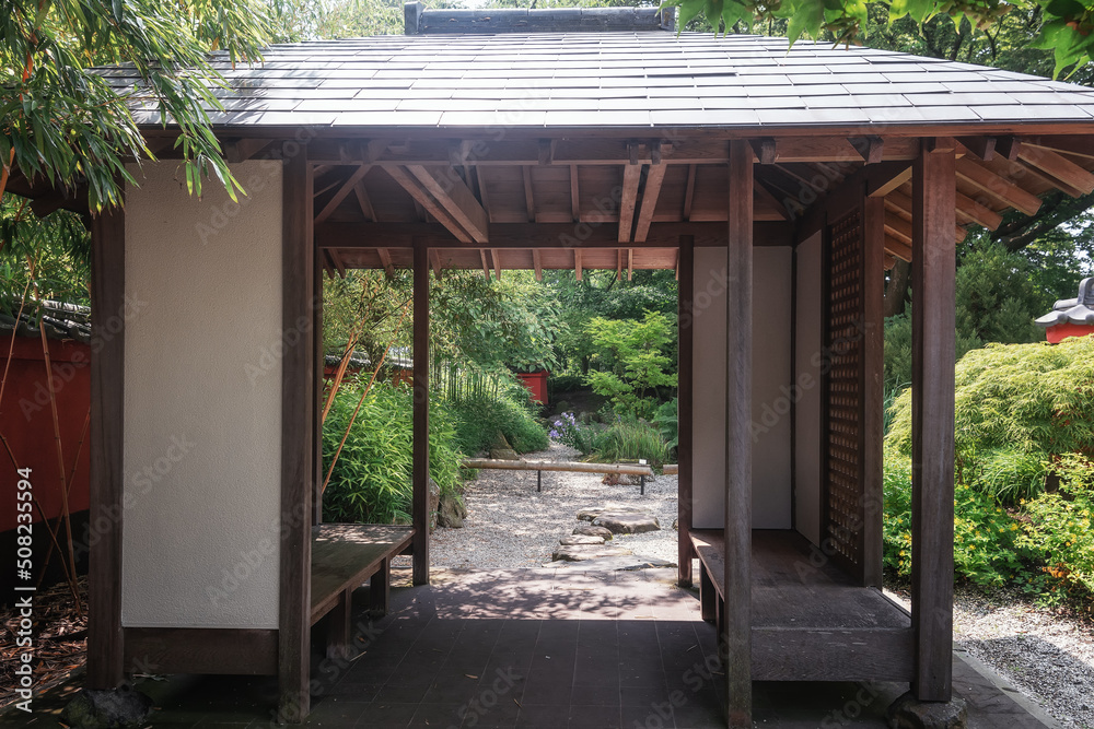 View of a Japanese garden through a Japanese-style gazebo. View of a Japanese garden through a Japanese-style gazebo.