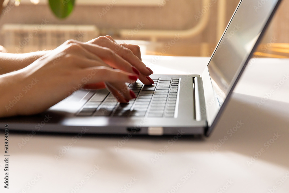 close up of female hands on a laptop keyboard. business concept close up of female hands on a laptop keyboard. business concept
