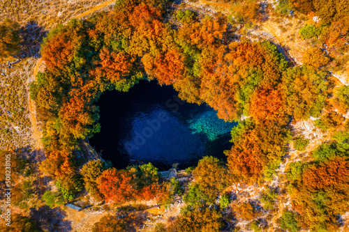 Melissani Cave with autumn colors. Famous Melissani lake on Kefalonia island, Karavomylos, Greece. On top of Melissani Cave (Melissani Lake) in Karavomylos village in Kefalonia island , Greece.