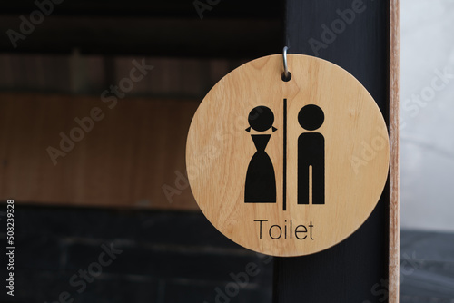 Restroom sign on a toilet door.Toilet sign - Restroom Concept - black tone.WC or Toilet icons set. Men and women WC signs for restroom with copy space for text. photo