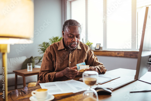 Old people, tax return and home banking. Angry senior man paying federal income taxes, doing family business plan. Elderly retired person and stress. Broken laptop pc, computer problems, technology