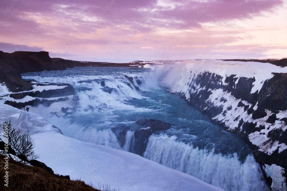 Gullfoss waterfall in Iceland. Beautiful grand waterfall at dramatic sunset, in early spring or winter.