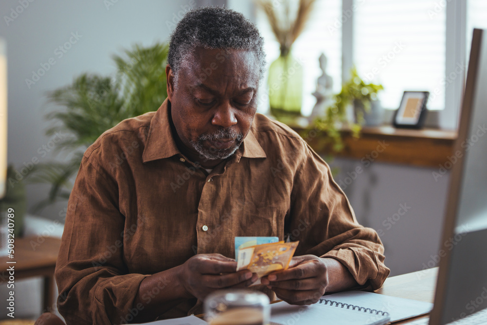 Worried senior man reading bad news in paper letter document feels disappointed, stressed old man troubled with high taxes or domestic bills, concerned about bank debt, financial problem concept
