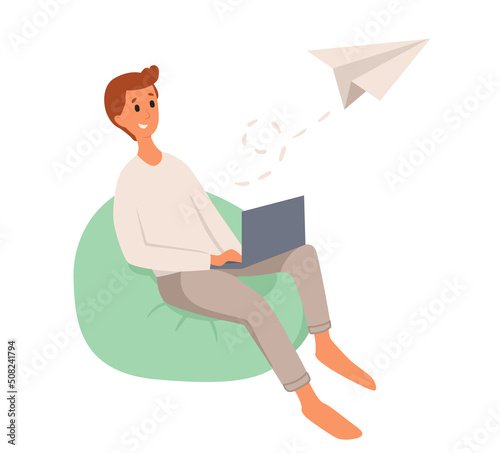 Young smiling man sitting, working with laptop on bean bag. Vector flat style cartoon illustration, isolated, white background. Man communicates using the internet.
