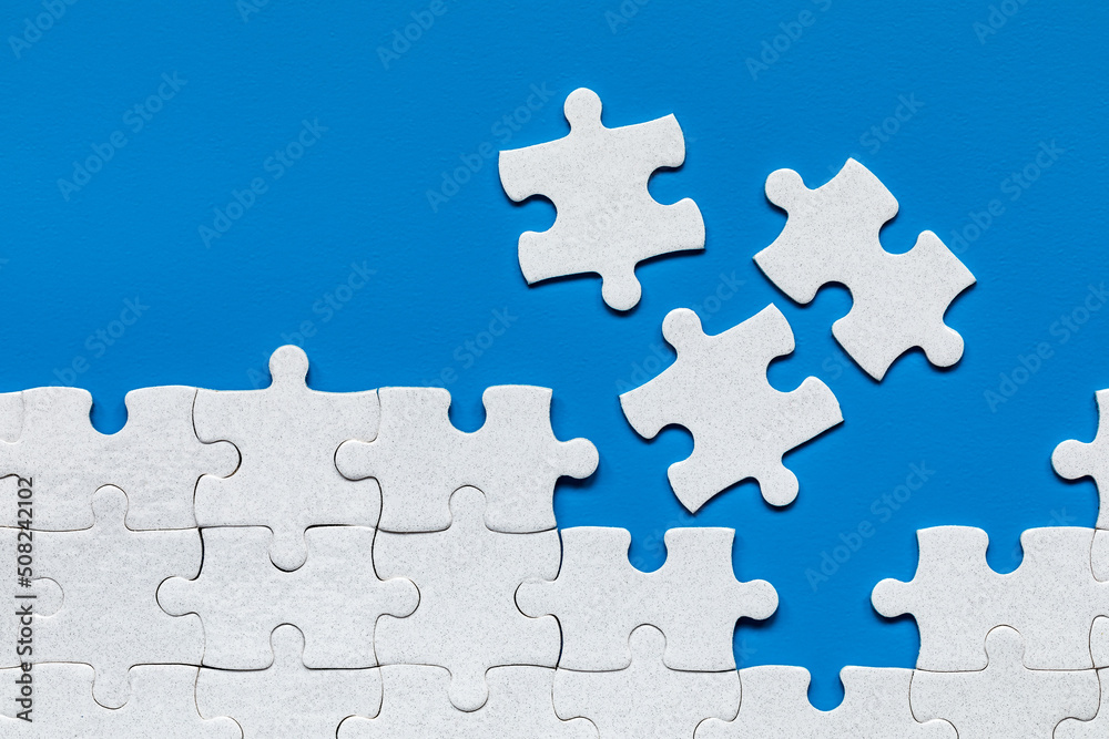 Closeup of jigsaw puzzle isolated. Missing jigsaw puzzle piece, business concept for completing the puzzle piece. Group of puzzle and a puzzle piece. Teamwork concept. Think difference concept. Closeup of jigsaw puzzle isolated. Missing jigsaw puzzle piece, business concept for completing the puzzle piece. Group of puzzle and a puzzle piece. Teamwork concept. Think difference concept.