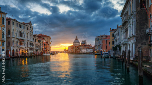 View of the street canal in Venice, Italy. Colorful facades of old Venice houses. Venice is a popular tourist destination of Europe. Venice, Italy.