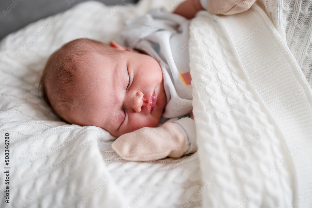 Portrait of a cute sleeping Caucasian newborn baby. Soft focus Portrait of a cute sleeping Caucasian newborn baby. Soft focus
