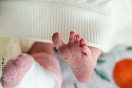 Small foot of a newborn baby, soft focus