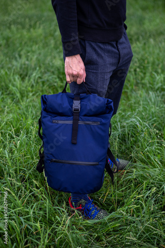 Holding a blue bag
