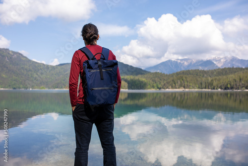 Man near the lake in the mountains