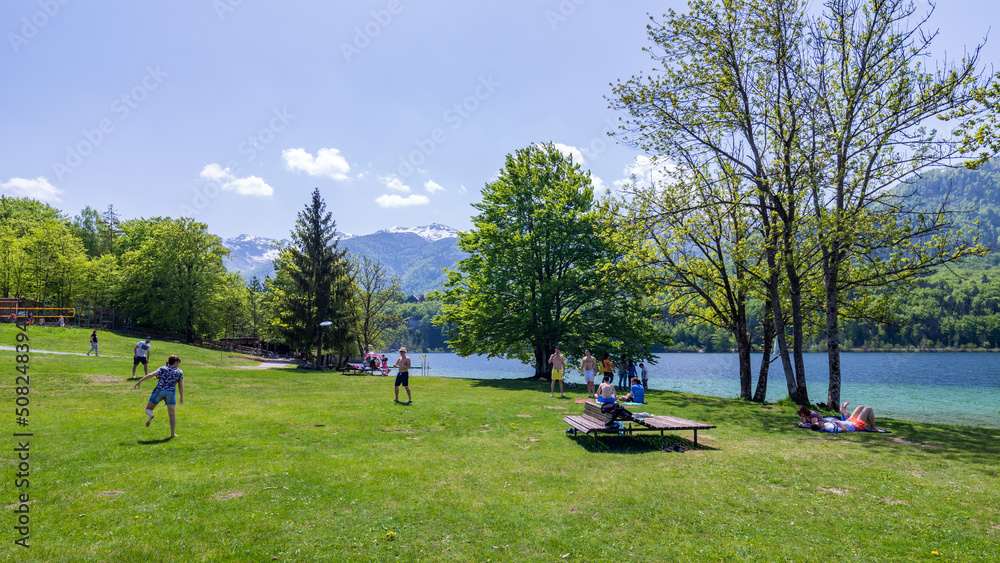 Bohinj, Slovenia - April 29, 2018: Lake Bohinj in Slovenia. Colorful summer on the Bohinj lake in Triglav national park Slovenia, Alps, Europe. Mountain Lake bohinj in Julian Alps, Slovenia Bohinj, Slovenia - April 29, 2018: Lake Bohinj in Slovenia. Colorful summer on the Bohinj lake in Triglav national park Slovenia, Alps, Europe. Mountain Lake bohinj in Julian Alps, Slovenia