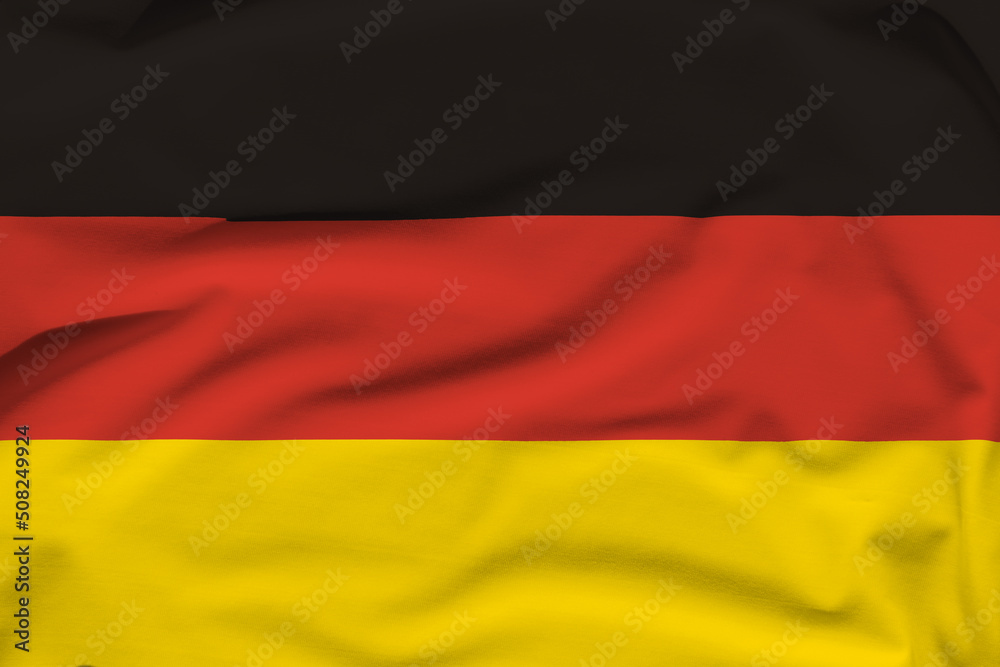 Naklejka premium Germany national flag, folds and hard shadows on the canvas