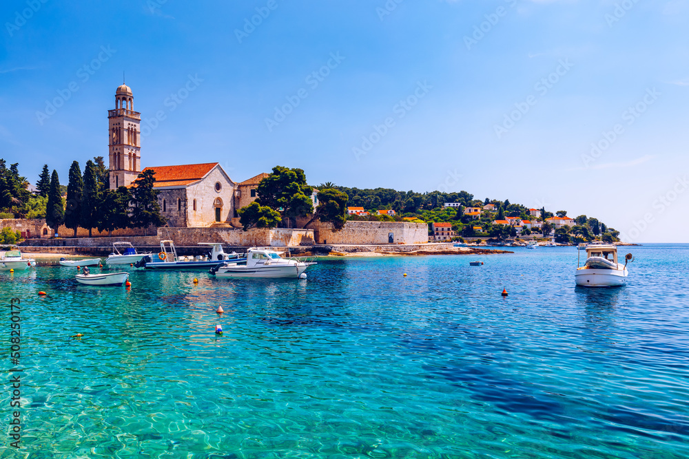 View at amazing archipelago with boats in front of town Hvar, Croatia. Harbor of old Adriatic island town Hvar. Popular touristic destination of Croatia. Amazing Hvar city on Hvar island, Croatia.