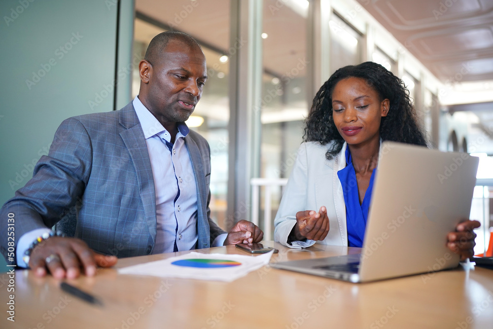 Business people in the workplace are discussing a working strategy for doing business