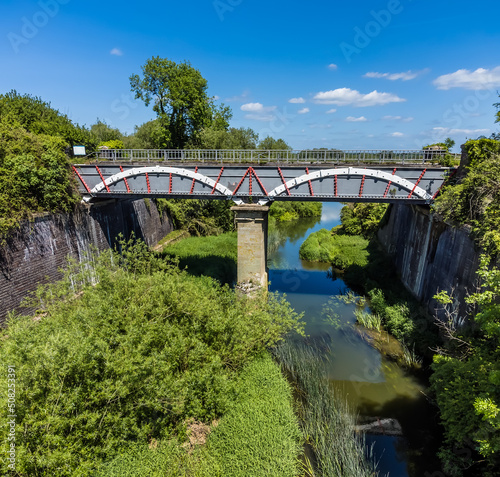 An aerial view of the Iron Trunk aqueduct and the Grand Union canal down the river Great Ouse at Wolverton, UK in summertime