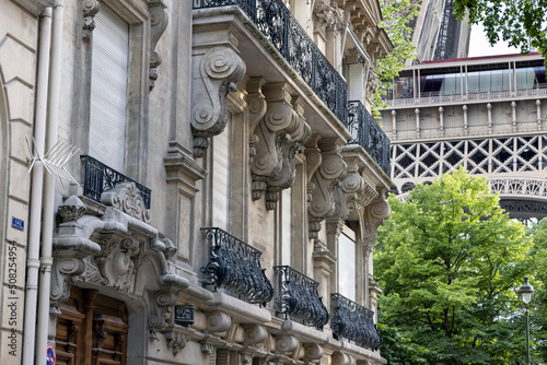 Street in Paris with a view of part of the Eiffel tower, Paris, France