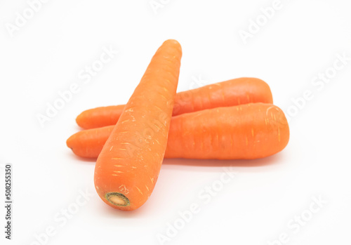 three Carrots isolated on white background. front view