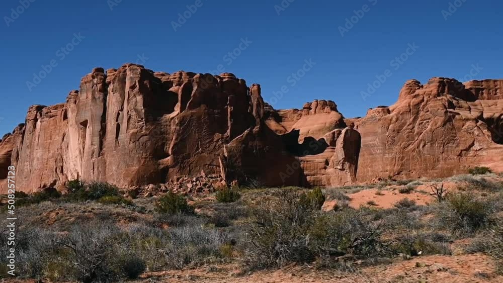 Driving alongside the Great Wall in Arches National Park during the day Driving alongside the Great Wall in Arches National Park during the day