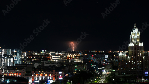 Lightning over the city at night. City out of focus. High quality photo © Татьяна Оракова