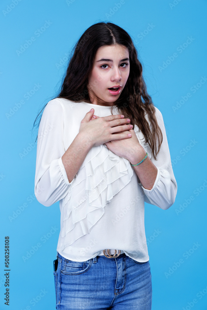 Shocked and appalled expression on a teenage girl, young teenager outraged by the news Shocked and appalled expression on a teenage girl, young teenager outraged by the news
