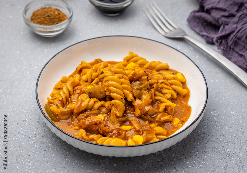 Red sauce pasta slow-cooked in tomato sauce, prepared with flavourful spices Red sauce pasta slow-cooked in tomato sauce, prepared with flavourful spices