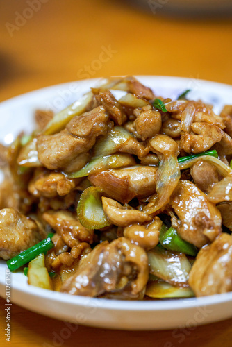 A delicious Chinese home-style dish, fried chicken thighs in Beijing green onion sauce