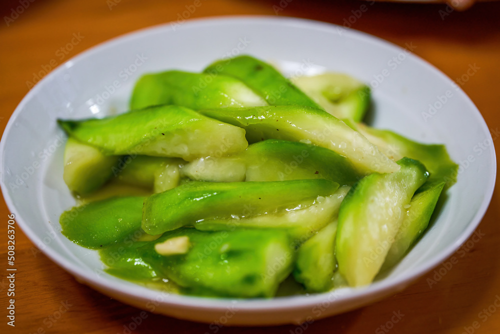A plate of light and fresh Chinese home cooking, stir-fried loofah A plate of light and fresh Chinese home cooking, stir-fried loofah