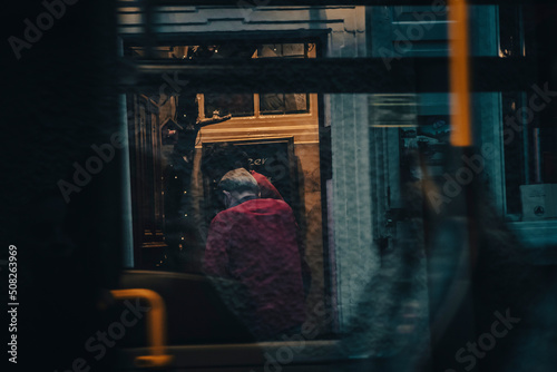 man on the bus window