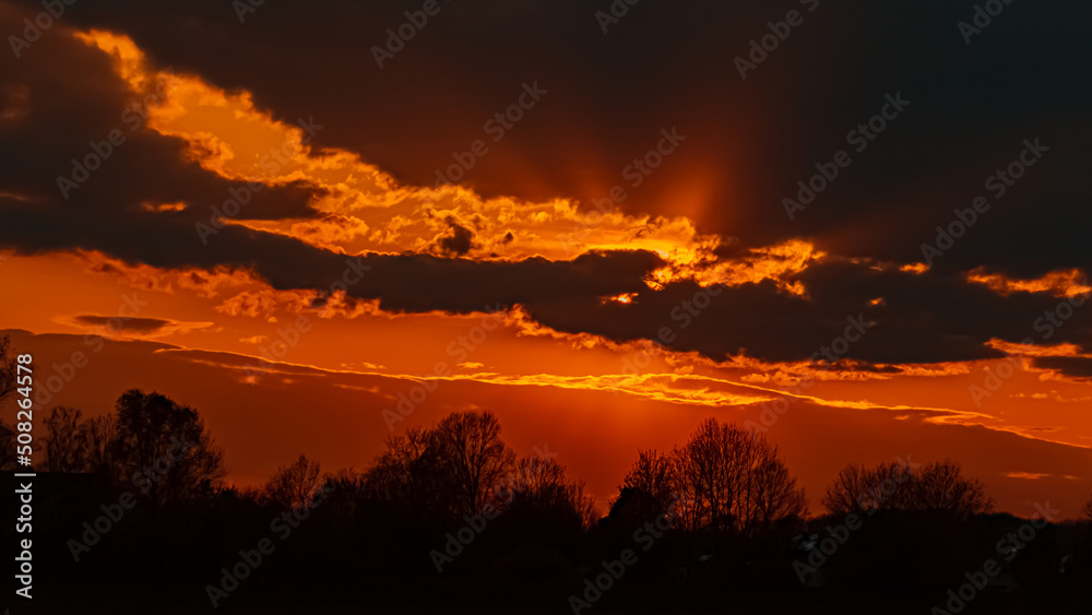 Beautiful sunset view with dramatic clouds near Plattling, Isar, Bavaria, Germany