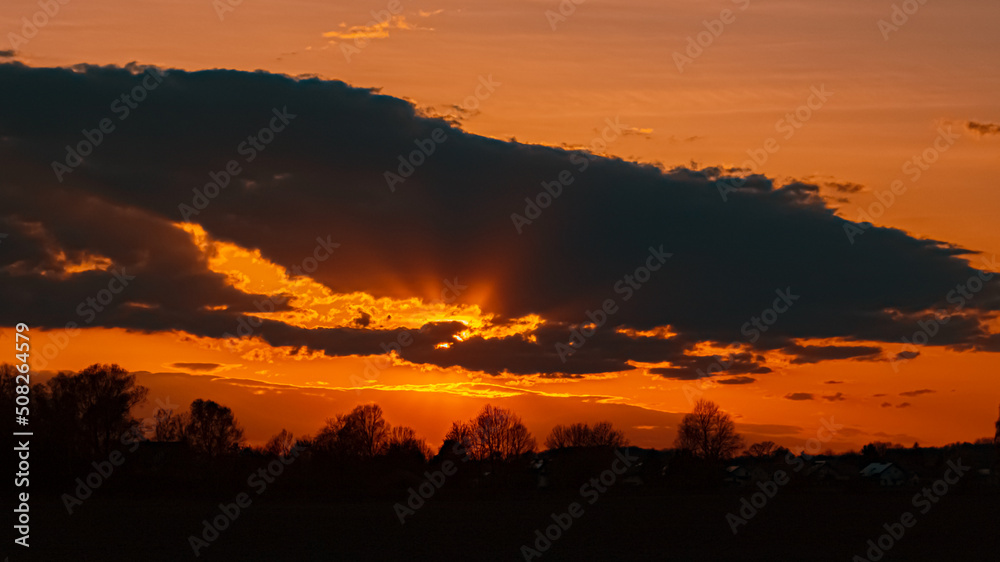 Fototapeta premium Beautiful sunset view with dramatic clouds near Plattling, Isar, Bavaria, Germany