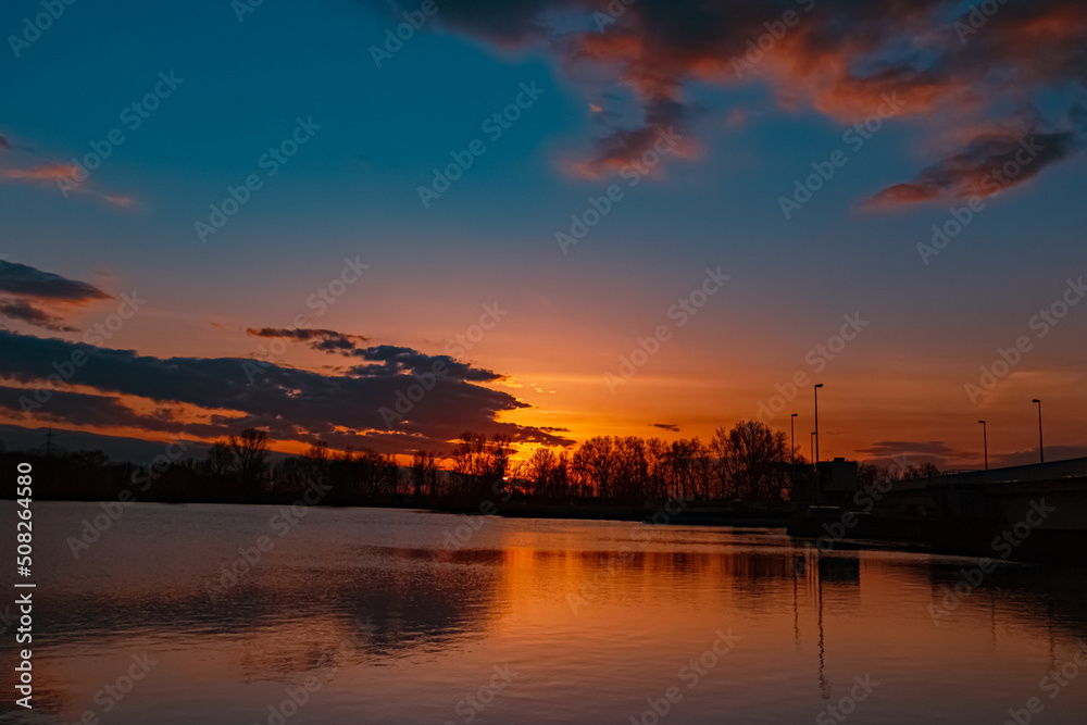 Beautiful sunset view with reflections near Plattling, Isar, Bavaria, Germany