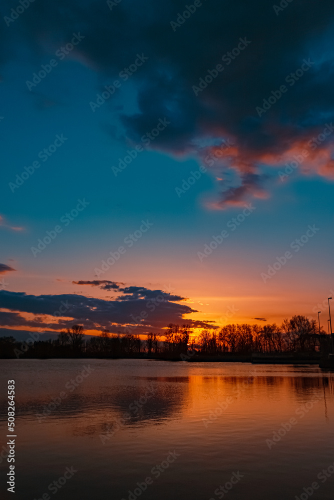 Beautiful sunset view with reflections near Plattling, Isar, Bavaria, Germany