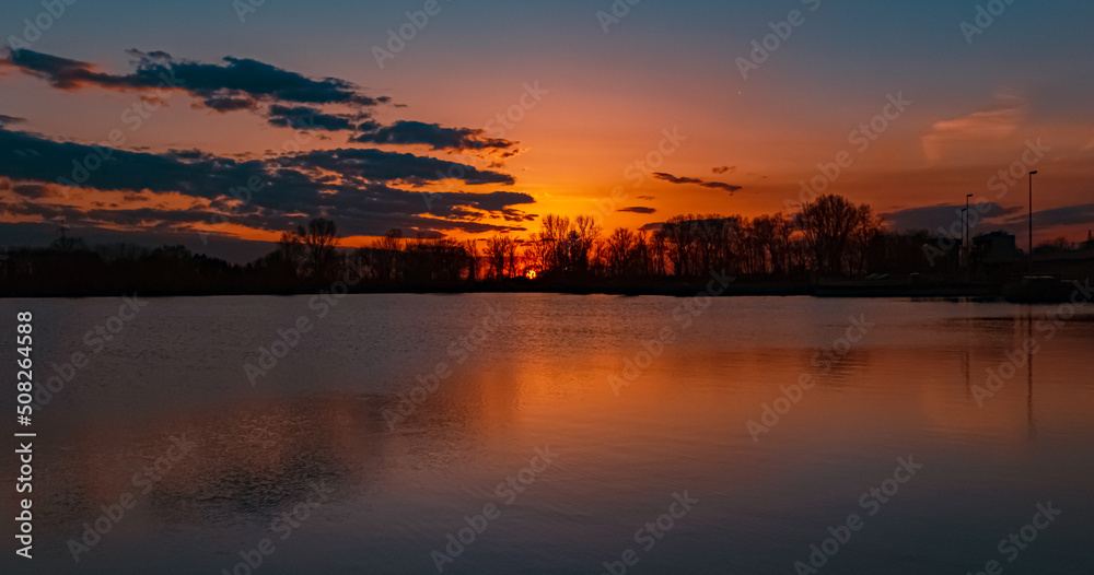 Beautiful sunset view with reflections near Plattling, Isar, Bavaria, Germany