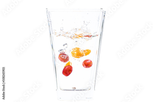 fruits fall into the glass