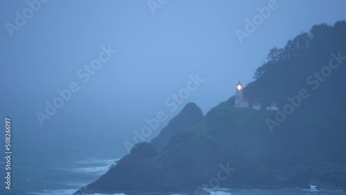 Haceta Lighthouse view from the Pacific Coast Highway on a rainy day photo