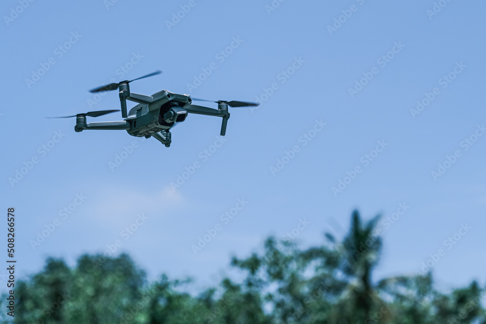 Fototapeta premium drone quadcopter with digital camera, Farmer use ai drone to monitor prediction forecast check, Agriculture drone fly for research analysis, Using unmanned aerial vehicle for land and building site