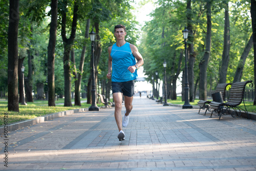 athletic man runner sprinting in sportswear outdoor