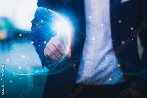 Futuristic innovation,technology,internet of Things network connect and data, businessman touching earth holographic interface activated, global communication digital network concept