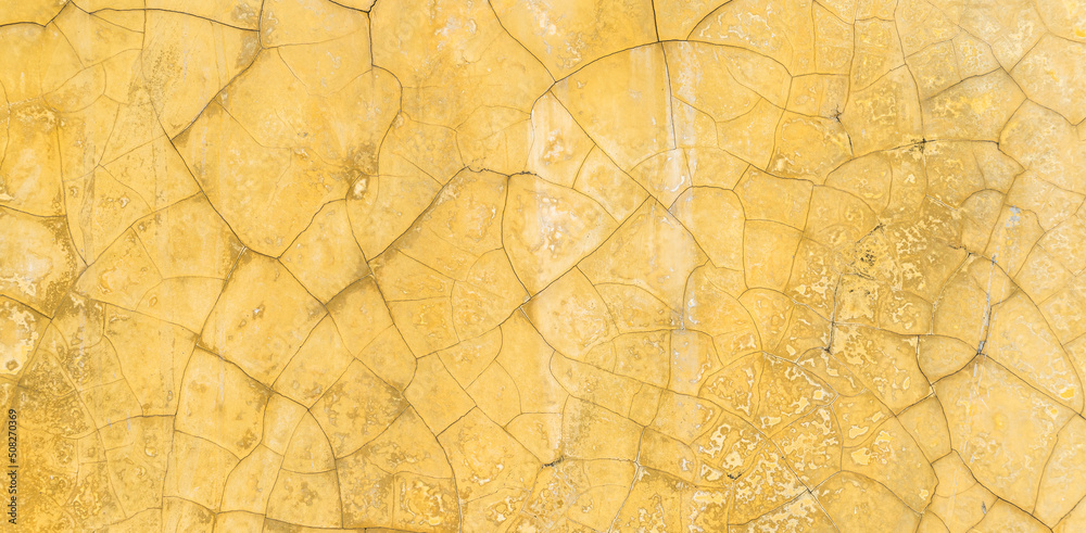 Old crack yellow cement wall texture background well editing text present on free space backdrop
