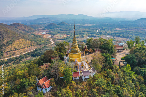 Aerial view of Wat Phra Phutthabat Tak Pha temple on top of the mountain in Lamphun, Thailand