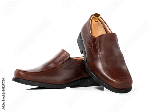 Men fashion brown leather collection loafer shoes with shoe tree (shape supporter) isolated on white background.