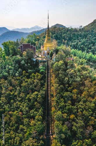 Aerial view of Wat Phra Phutthabat Tak Pha temple on top of the mountain in Lamphun, Thailand photo