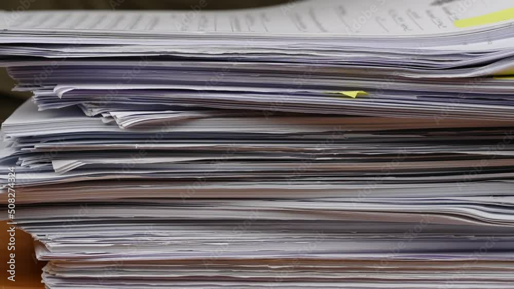 Businessman are searching for documents lying on the table, business report papers, important documents. Businessman are searching for documents lying on the table, business report papers, important documents.