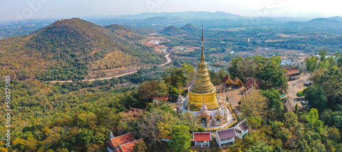 Aerial view of Wat Phra Phutthabat Tak Pha temple on top of the mountain in Lamphun, Thailand photo