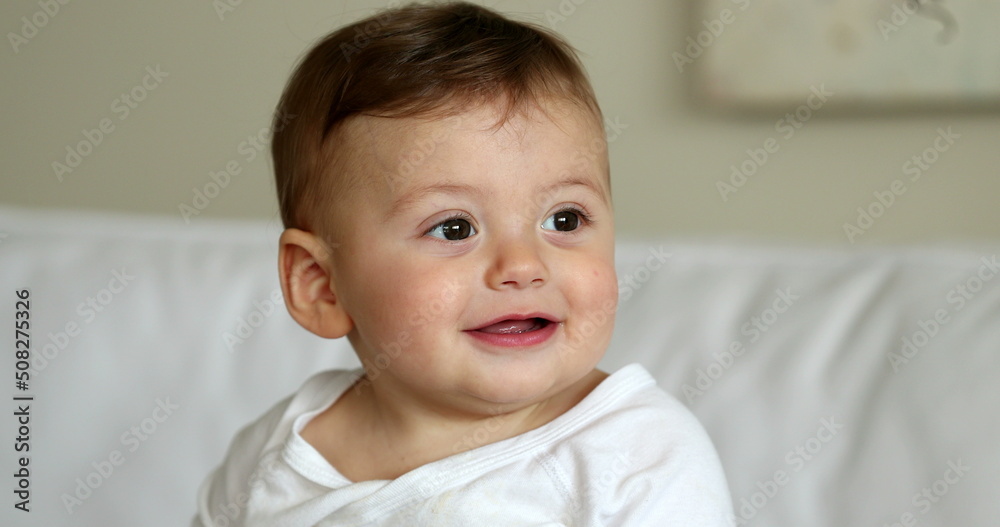 Cute baby infant boy portrait face smiling. Adorable beautiful sweet toddler child