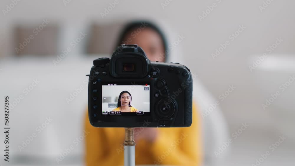 Close up shot of digital camera screen with young happy african american lady blogger, selective focus Close up shot of digital camera screen with young happy african american lady blogger, selective focus