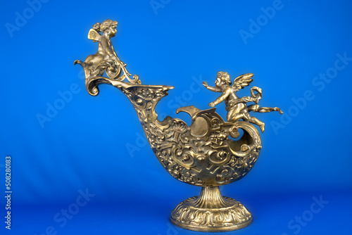 antique vase with figurines of angels, vintage bronze vase, ancient jug, bronze vessel with figurines, vintage bronze vessel