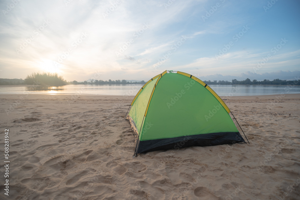 camping on the beach with blue skies