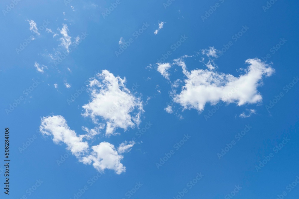 white fluffy clouds in the blue sky white fluffy clouds in the blue sky