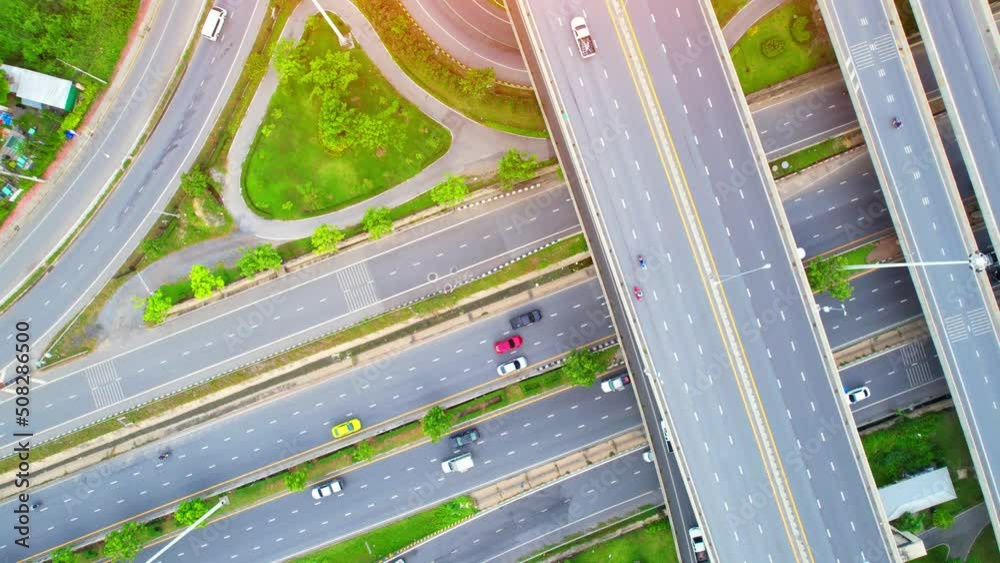 4K : Aerial view and top view of traffic on city. Expressway with car lots. Beautiful aerial top view from drone. Nonthaburi, thailand.
